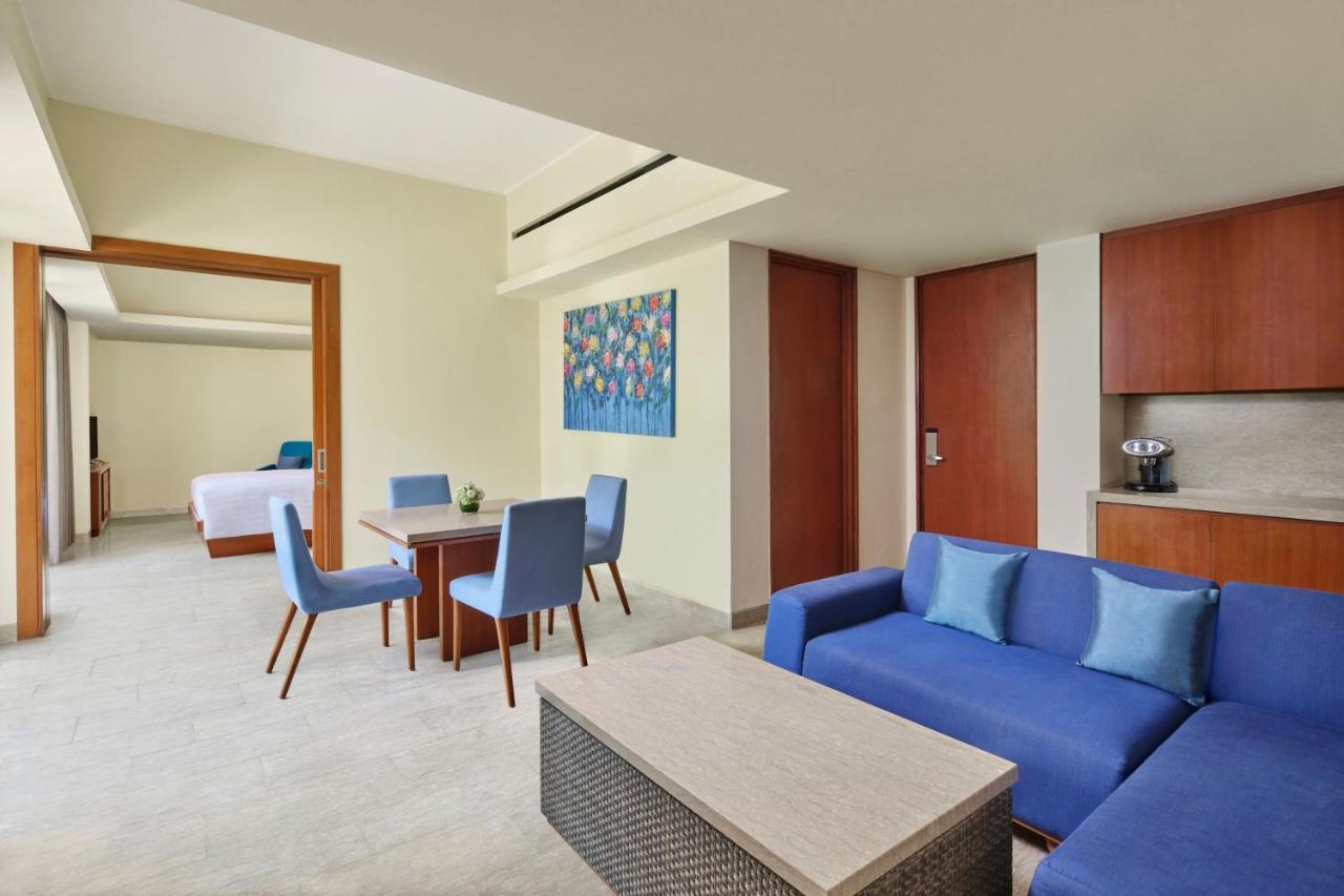 One-Bedroom King Suite with Balcony & Pool View